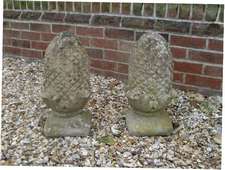 A pair of reconstituted stone finials