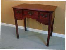 A Georgian mahogany lowboy