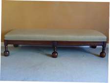 A Victorian long stool with ball feet