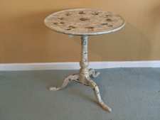 A 19thC decoupage covered tripod table