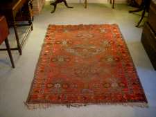 An antique Kazak rug