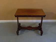 A low Regency rosewood side table