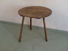 An antique sycamore cricket table