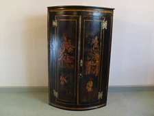 A Georgian chinoisorie decorated corner cupboard