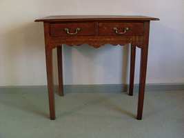 A Georgian oak lowboy