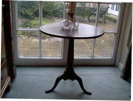 A Georgian tilt top tripod table