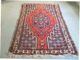 An antique Caucasian rug