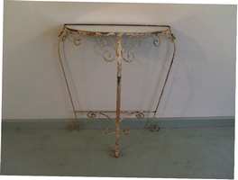 A mirror topped ironwork hall table
