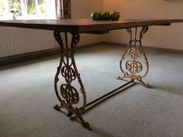 A six seater french cast iron based table