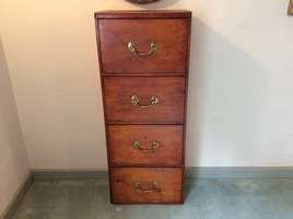 A tall chest of 4 drawers