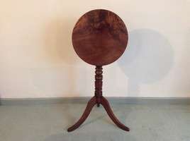 A Georgian tilt top tripod wine table