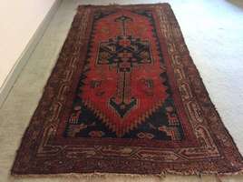 An antique caucasian rug