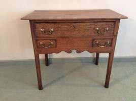 A Georgian oak lowboy