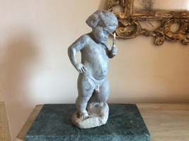 A small 19thC lead putto