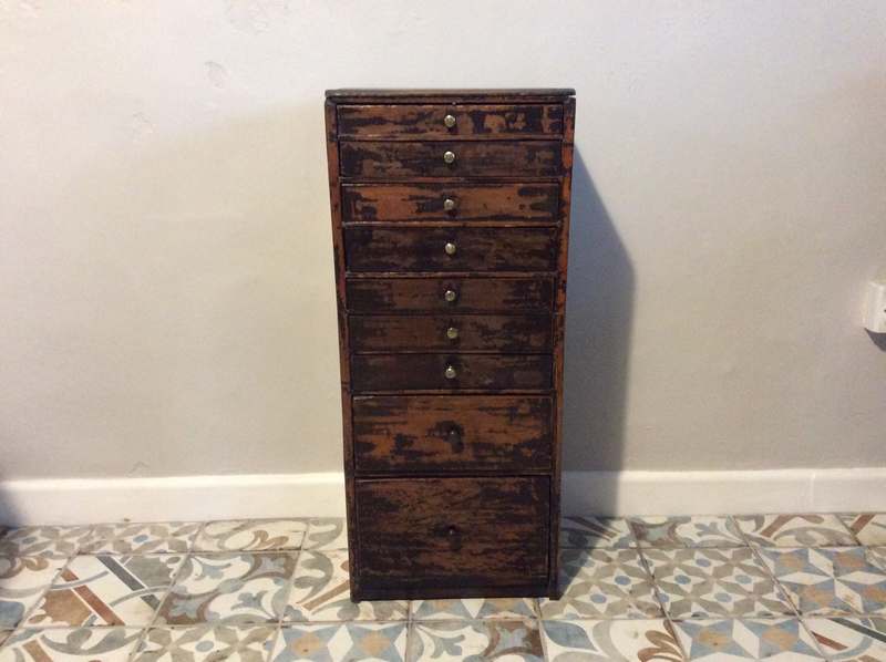 A watchmakers tall bank of drawers