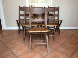 A set of six folding chairs