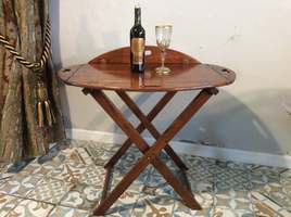 An oval butlers tray on stand