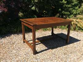 An extendable french cherry farmhouse table