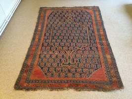 An antique Caucasian prayer rug