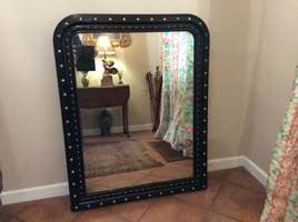 An ebonized French overmantle mirror