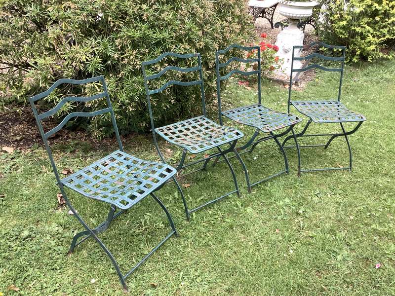 A set of 4 French folding iron garden chairs