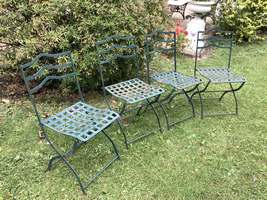 A set of 4 French folding iron garden chairs