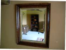 A grand Victorian maple framed mirror